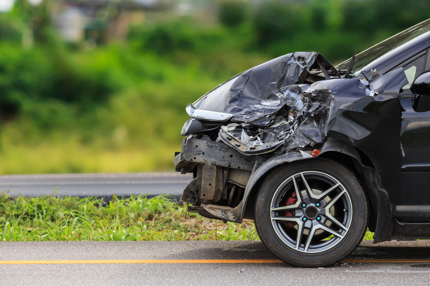 front-black-car-get-damaged-by-accident-road